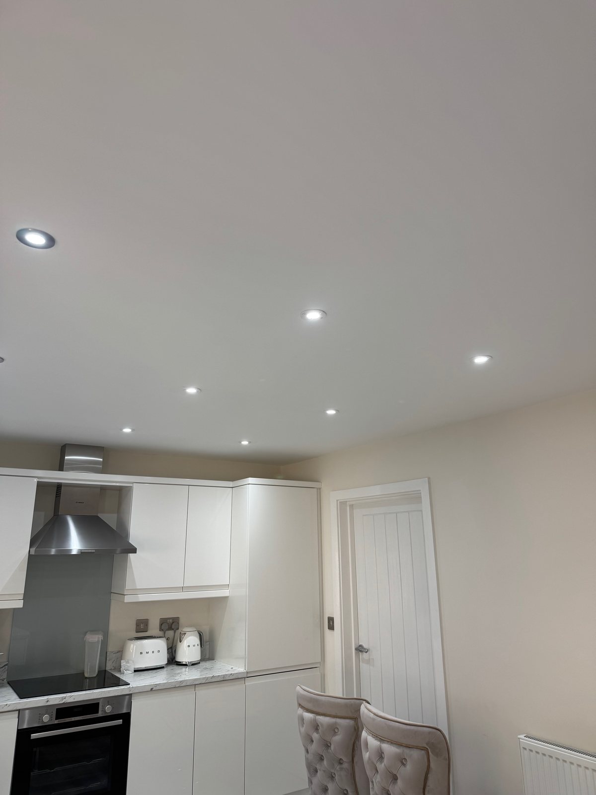 Completed kitchen ceiling with evenly spaced LED spotlights